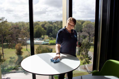 Cleaner cleaning a table